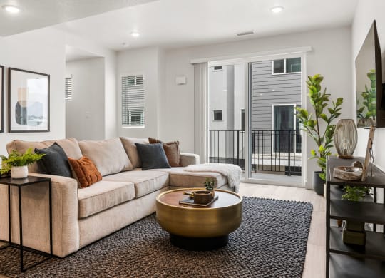 a living room with a large couch and a coffee table