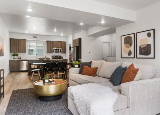 our apartments offer a living room with a sofa coffee table and a kitchen with a breakfast bar