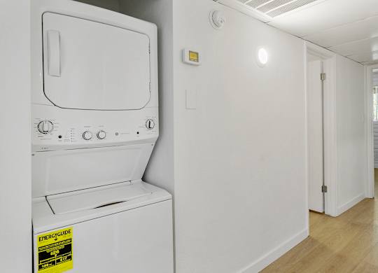 A white oven with a sticker on it.