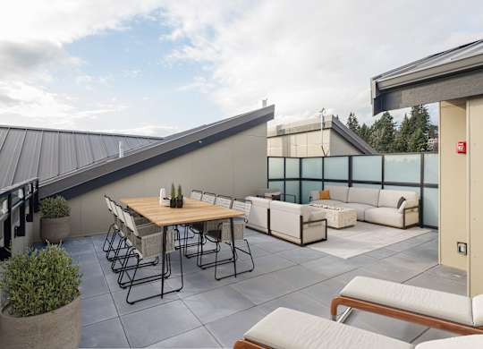 A patio with a table and chairs is shown.