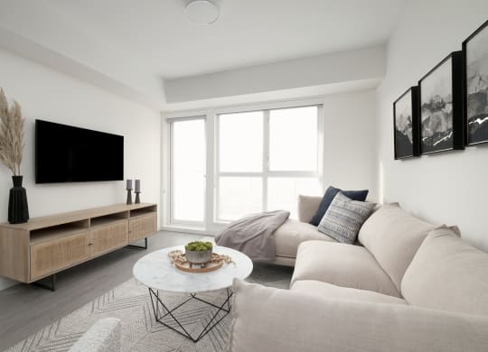a living room with a couch and a table and a television