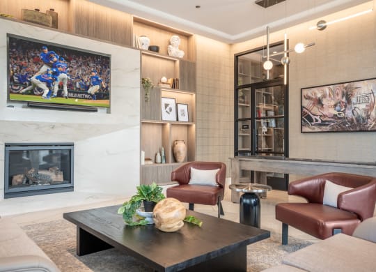 a living room with a fireplace and a tv on the wall