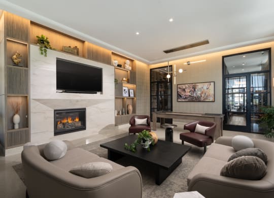 a living room filled with furniture and a large fireplace