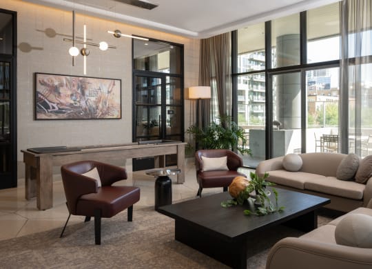 a living room filled with furniture and a large window