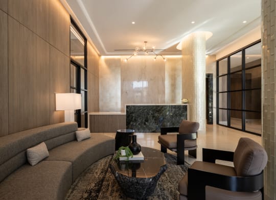 a living room filled with furniture and a large window