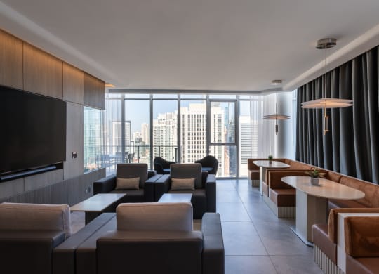 a living room filled with furniture and a large window
