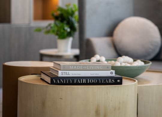 a table with a stack of books on top of it