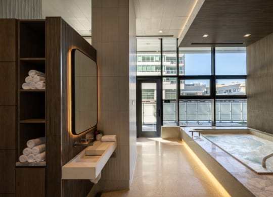 a bathroom with a large window and a bathtub