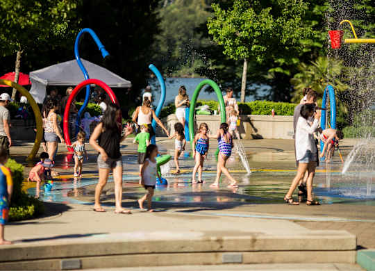 A group of people are playing in a water park.