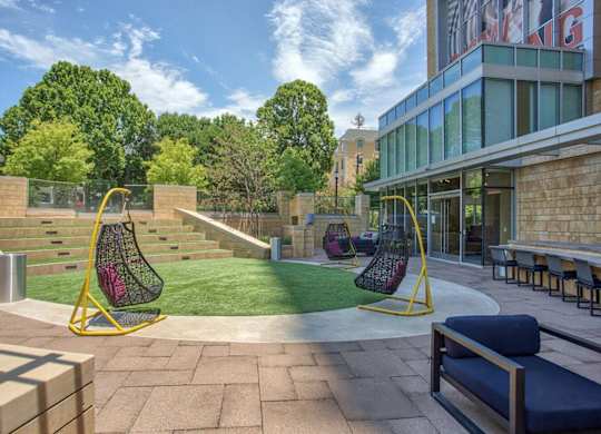 A playground with a swing set and a slide.