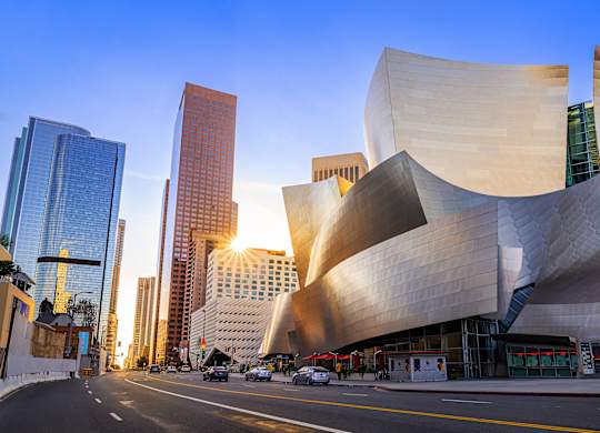 A modern building with curved walls dominates the skyline.