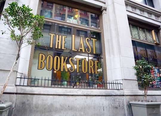 A tree is in front of a bookstore.