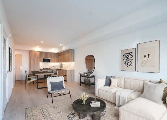 a living room with a white couch and a table