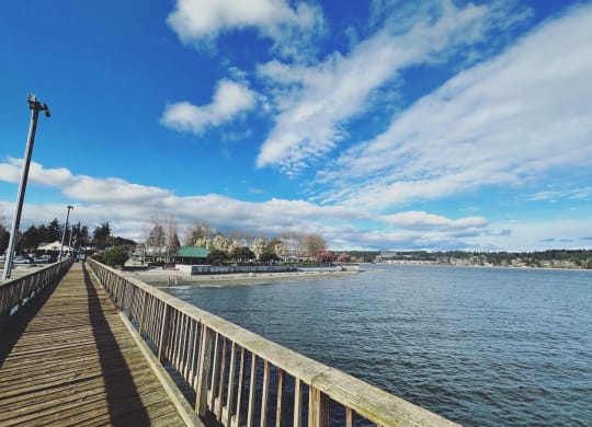 a wooden pier with a blue sky in the background at Rivulet, Washington, 98383