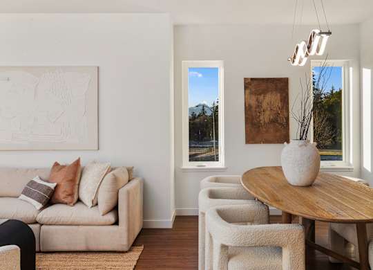 A living room with a couch, chairs, and a table. at The Narrows at Clare Apartments , Bremerton, 98310