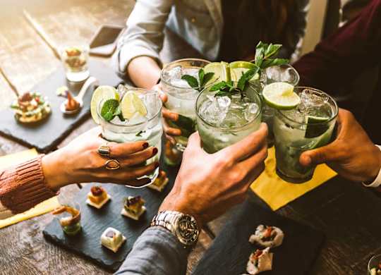 A group of people toasting with mint juleps at a social gathering at B Flats Apartments, Bremerton, 98337