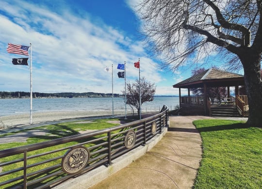 a path leading to a gazebo with a view of the water at Rivulet, Washington