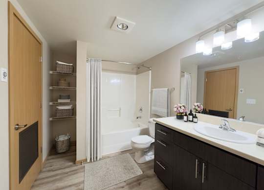 a bathroom with a sink and a toilet and a shower at Spyglass Hill Apartments, Washington