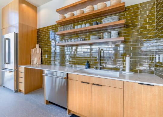 a kitchen with wood cabinets and stainless steel appliances at Marina Square, Bremerton, 98337