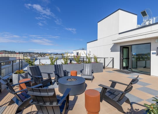 a terrace with a table and chairs on a sunny day at Marina Square, Washington