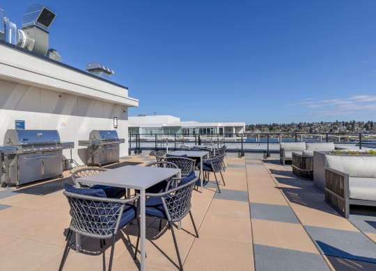 a terrace with tables and chairs on the top of a building at Marina Square, Bremerton, 98337
