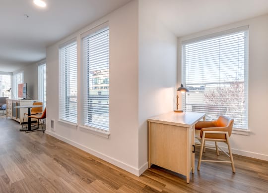 a living area with hardwood floors and large windows at Marina Square, WA 98337