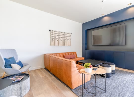 a living room with white walls and a blue accent wall at Marina Square, Bremerton, WA