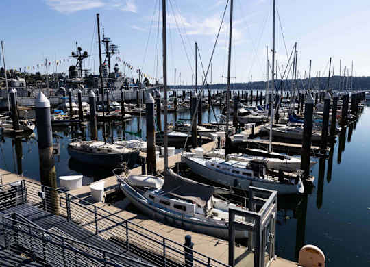 A marina with boats docked at the pier.