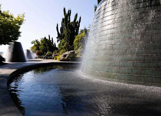 A wall with water flowing out of it.