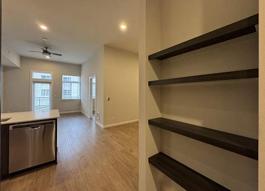 A kitchen with a dishwasher and a window at B Flats Apartments, Bremerton, WA, 98337
