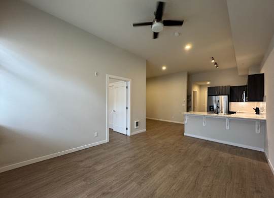 A room with a ceiling fan and lighting fixtures at B Flats Apartments, Bremerton, Washington