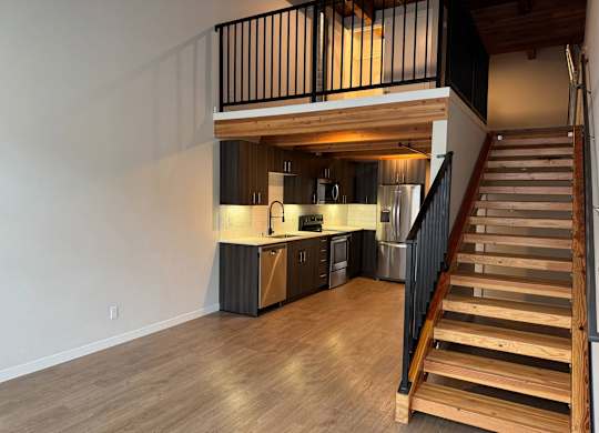 Kitchen area with staircase at B Flats Apartments, Bremerton