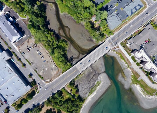 an aerial view of a bridge over a body of water at Rivulet, Silverdale Washington