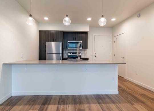 a kitchen with a counter top and a refrigerator at Rivulet, Washington