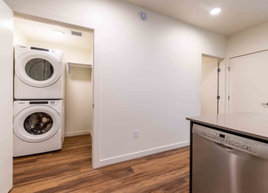 a washer and dryer in a laundry room with a counter top and at Rivulet, Silverdale Washington