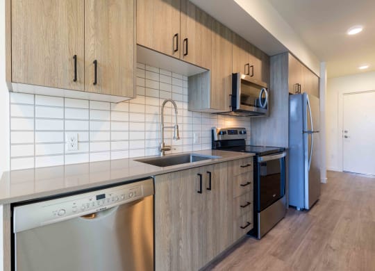 a kitchen with a sink and a stove and a refrigerator at Rivulet, Washington, 98383