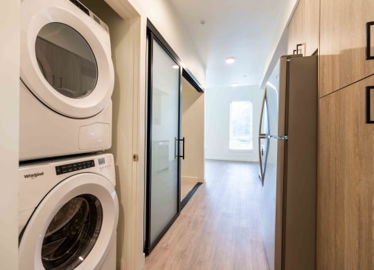 a washer and dryer in a laundry room with a door at Rivulet, Washington, 98383