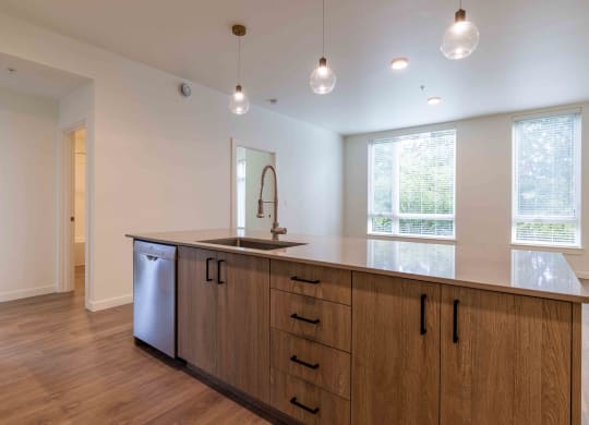 a kitchen with a large counter top and a sink at Rivulet, Silverdale, 98383