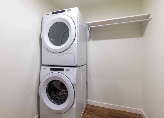 a washing machine and a dryer in a laundry room at Rivulet, Silverdale, 98383
