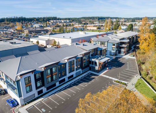 an aerial view of a building with a city in the background at Rivulet, Silverdale, 98383