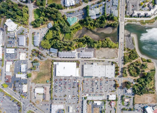 an overhead view of a city with a body of water and buildings at Rivulet, Washington