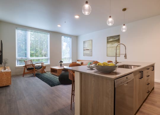 an open living room with a kitchen and dining area at Rivulet, Silverdale, WA