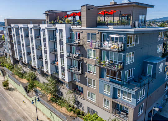 an aerial view of a large apartment building with balconies and decks at Spyglass Hill Apartments, Bremerton, 98337