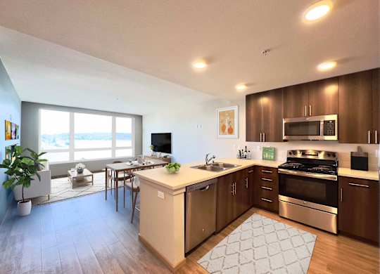 A kitchen with a stove, oven, and sink.