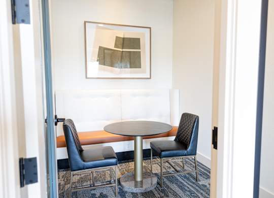 coworking office space with banquet and table with chairs seating