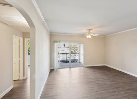 spacious living room with wood-inspired  floors at Bridgeport Ranch apartments
