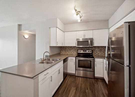 spacious kitchen with stainless steel appliances at Dakota Ridge apartments