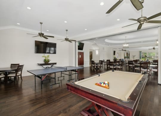 social lounge and game room area with billiards and ping pong at Retreat at Wylie senior 55+ apartments