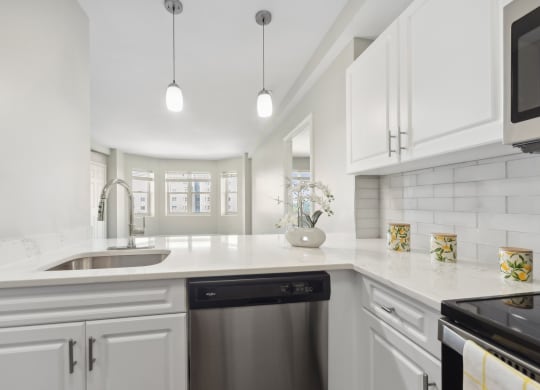 kitchen with designer pendant lighting and custom cabinetry at HighPoint luxury apartments