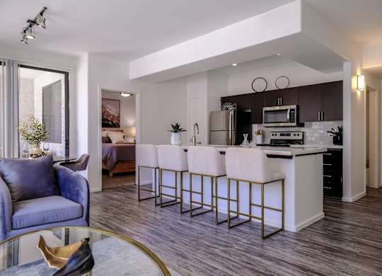 spacious, open-concept kitchen and living room at Avora apartments